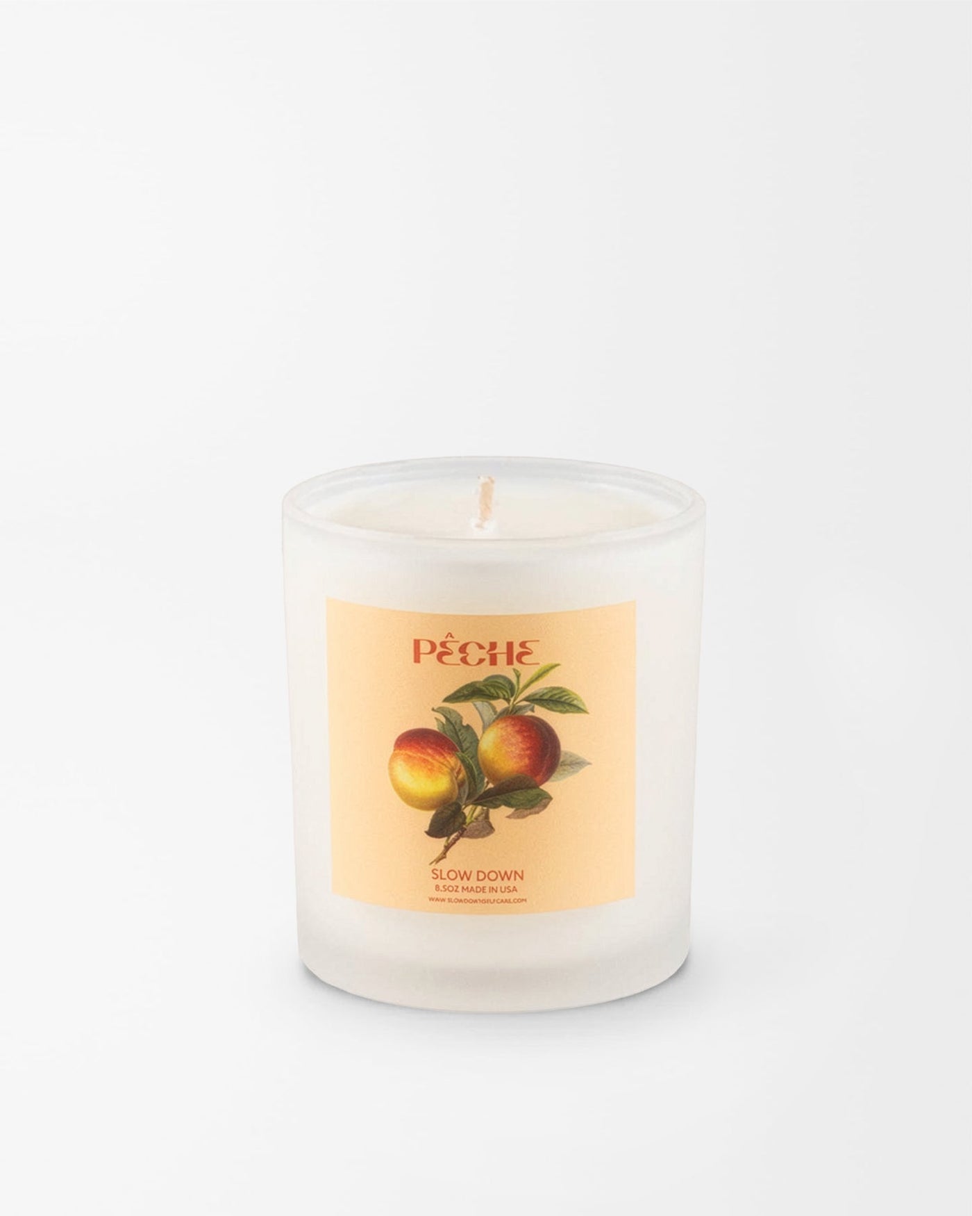 SLOW DOWN Pêche Candle, peach flesh and juicy plum, uniquely wrapped in a rich velvet | Here & Always