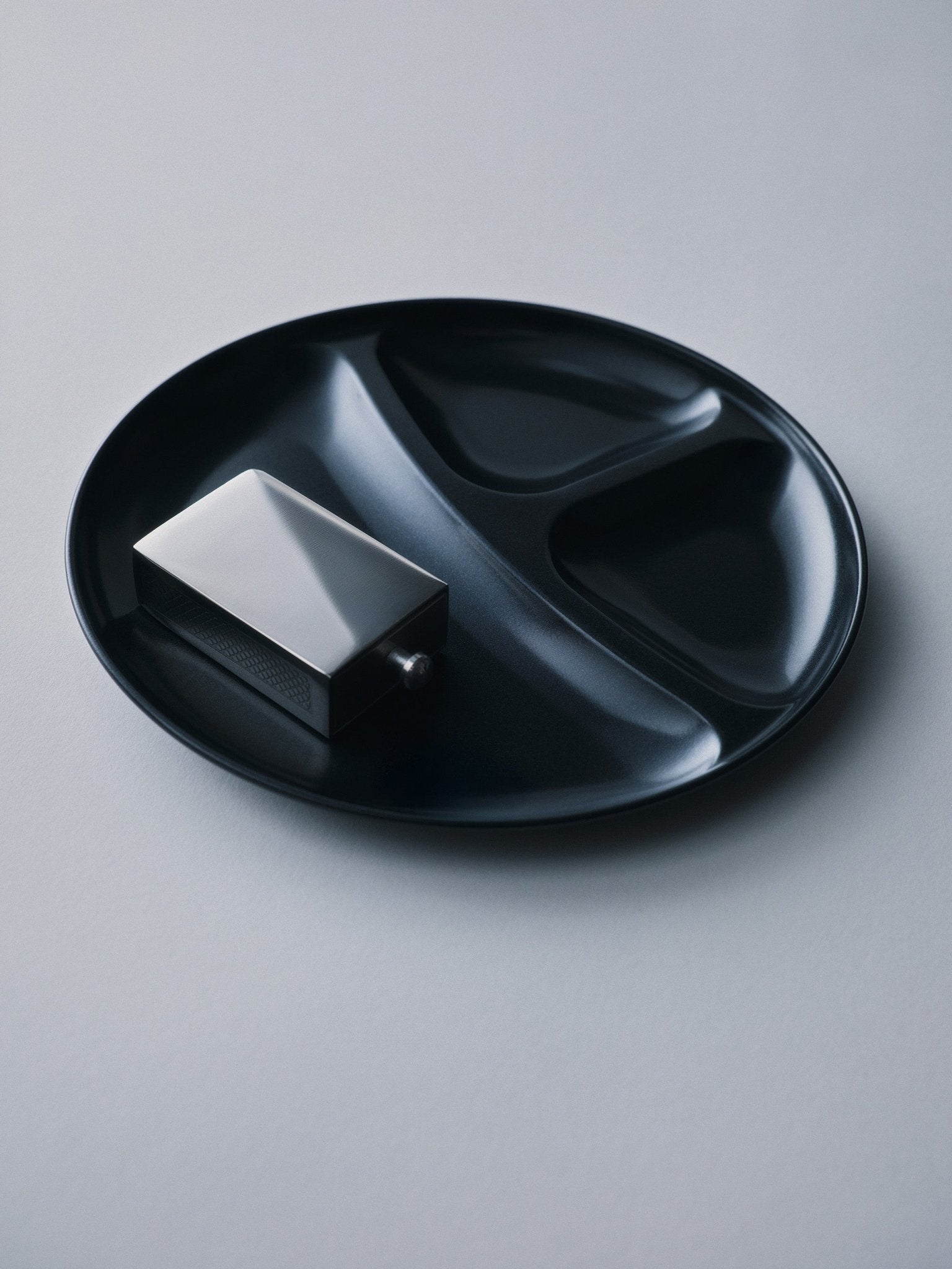 Personalized polished silver matchbox styled on a designer black plate, lifestyle photo | Here & Always