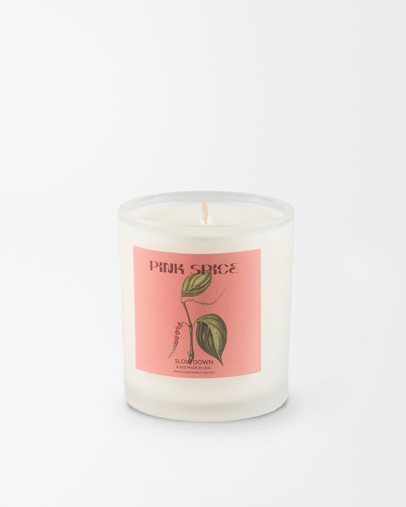 SLOW DOWN Pink Spice Candle, bright pink pepper and green foliage blend into resinous sandalwood and vanilla amber | Here & Always