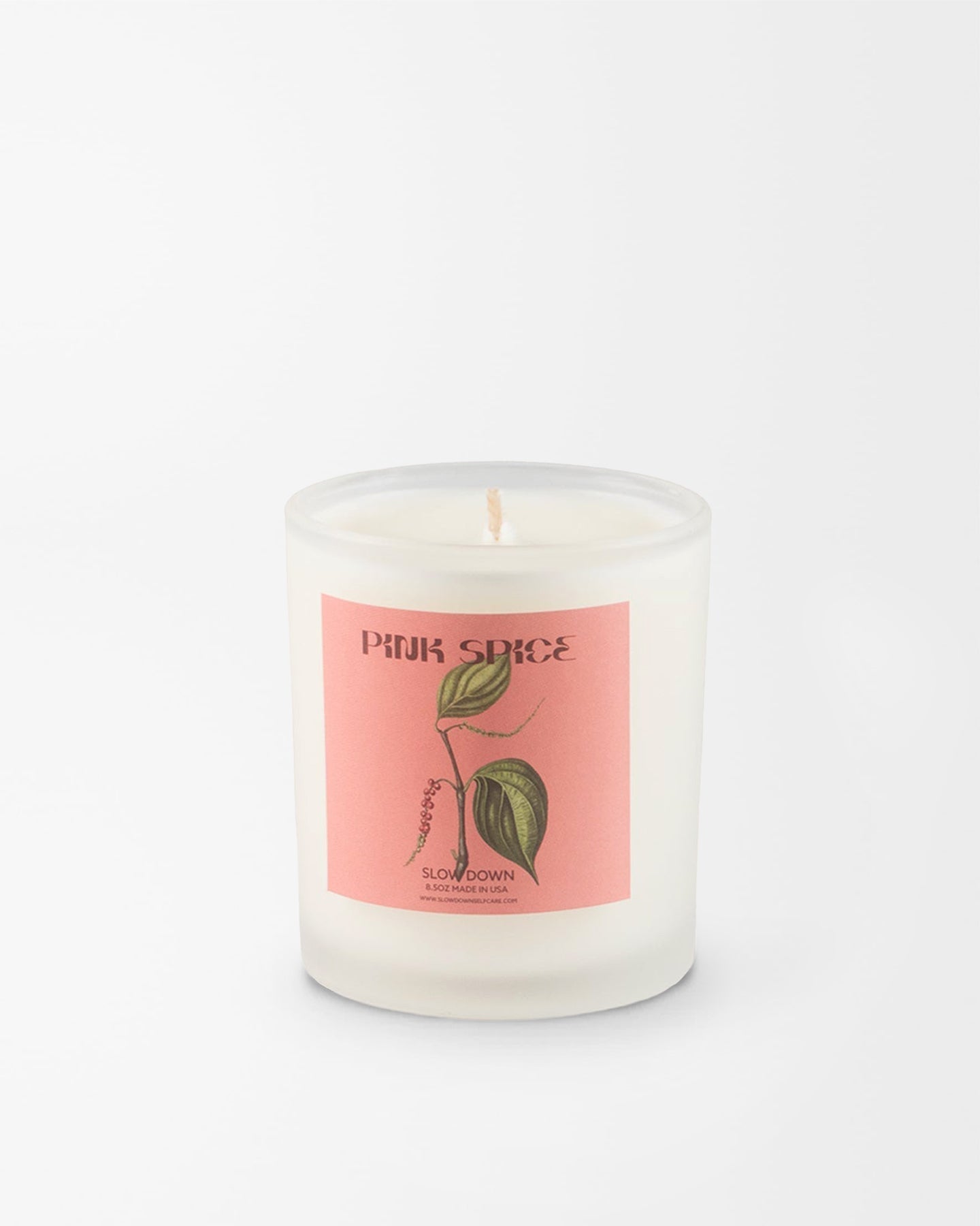 SLOW DOWN Pink Spice Candle, bright pink pepper and green foliage blend into resinous sandalwood and vanilla amber | Here & Always