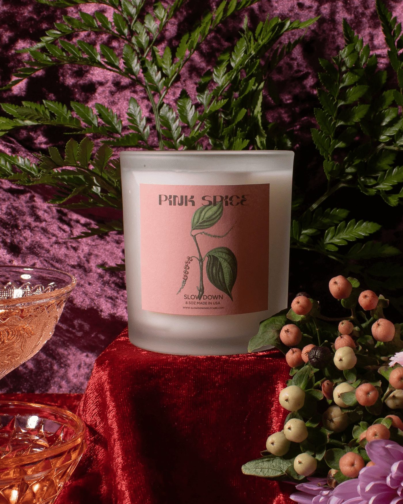 Slow Down Selfcare Pink Spice candle from Pink Spice Kairos Set in frosted glass vessel on textured background.